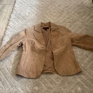 2 medium sized jackets, one fake leather other softer tan jacket